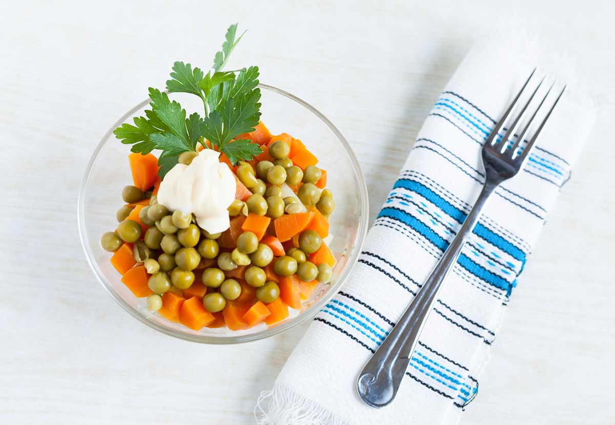 Vegetarian salad with canned peas, boiled carrots